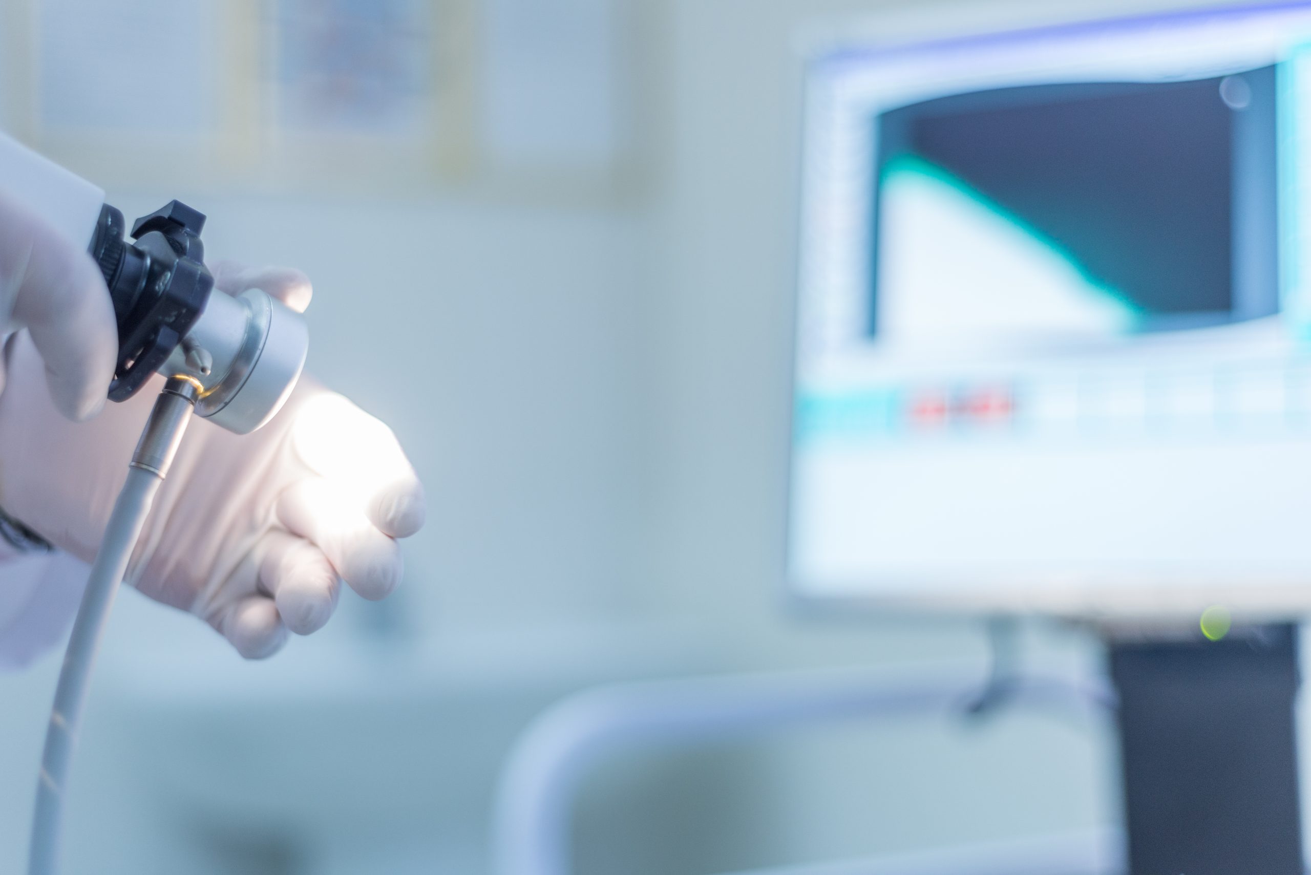 proctologist holding anoscope